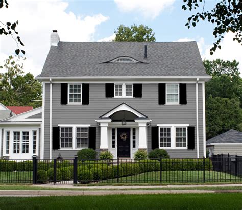 light grey house with metal roof|grey houses with black shutters.